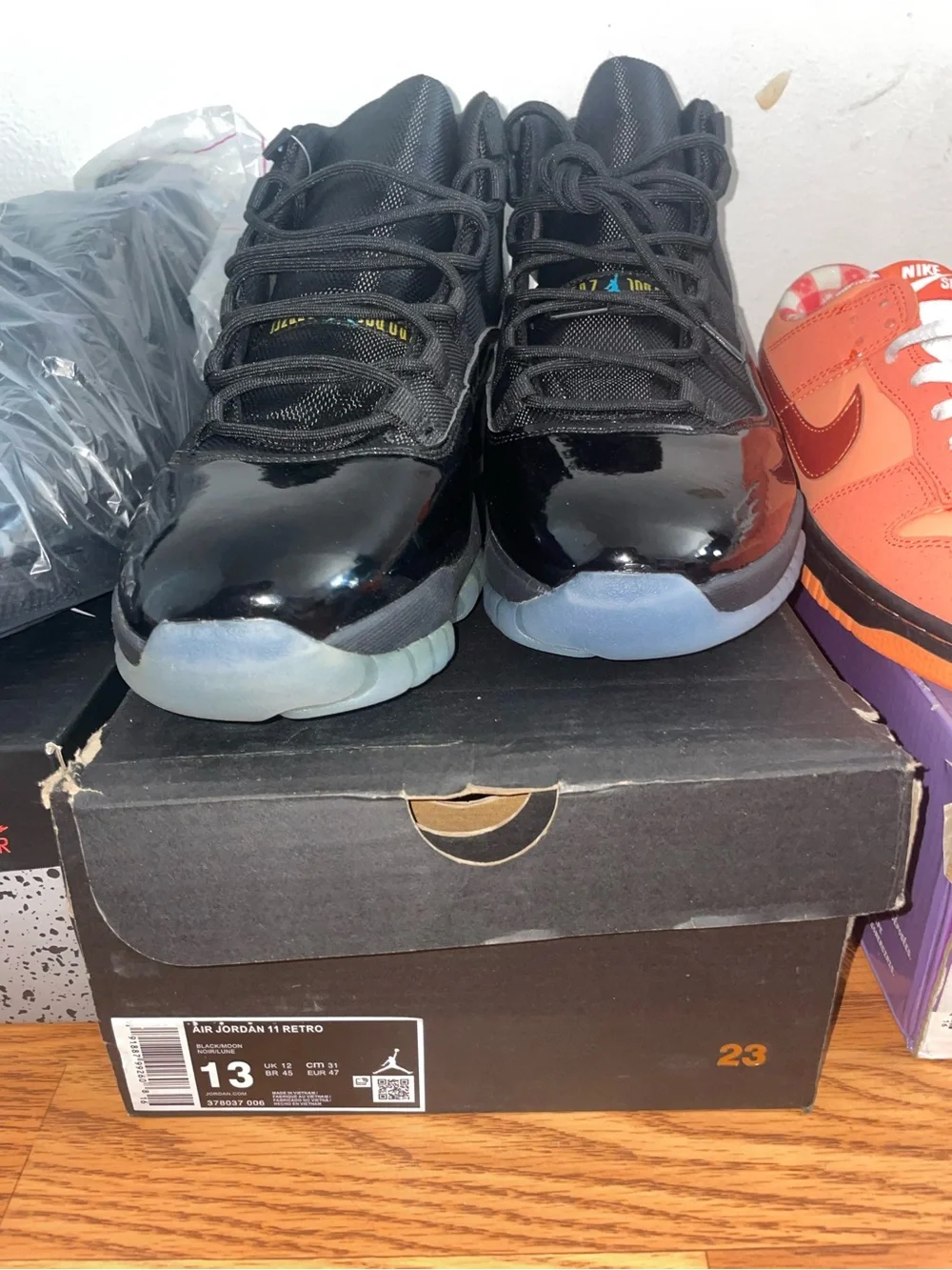 Jordan Air Jordan 11 Retro Black Patent Leather with Icy Blue Sole